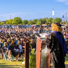 Dr. Kim Armstrong speaking at the 8th Annual Commencement