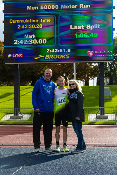 CJ Albertson standing in front of scoreboard