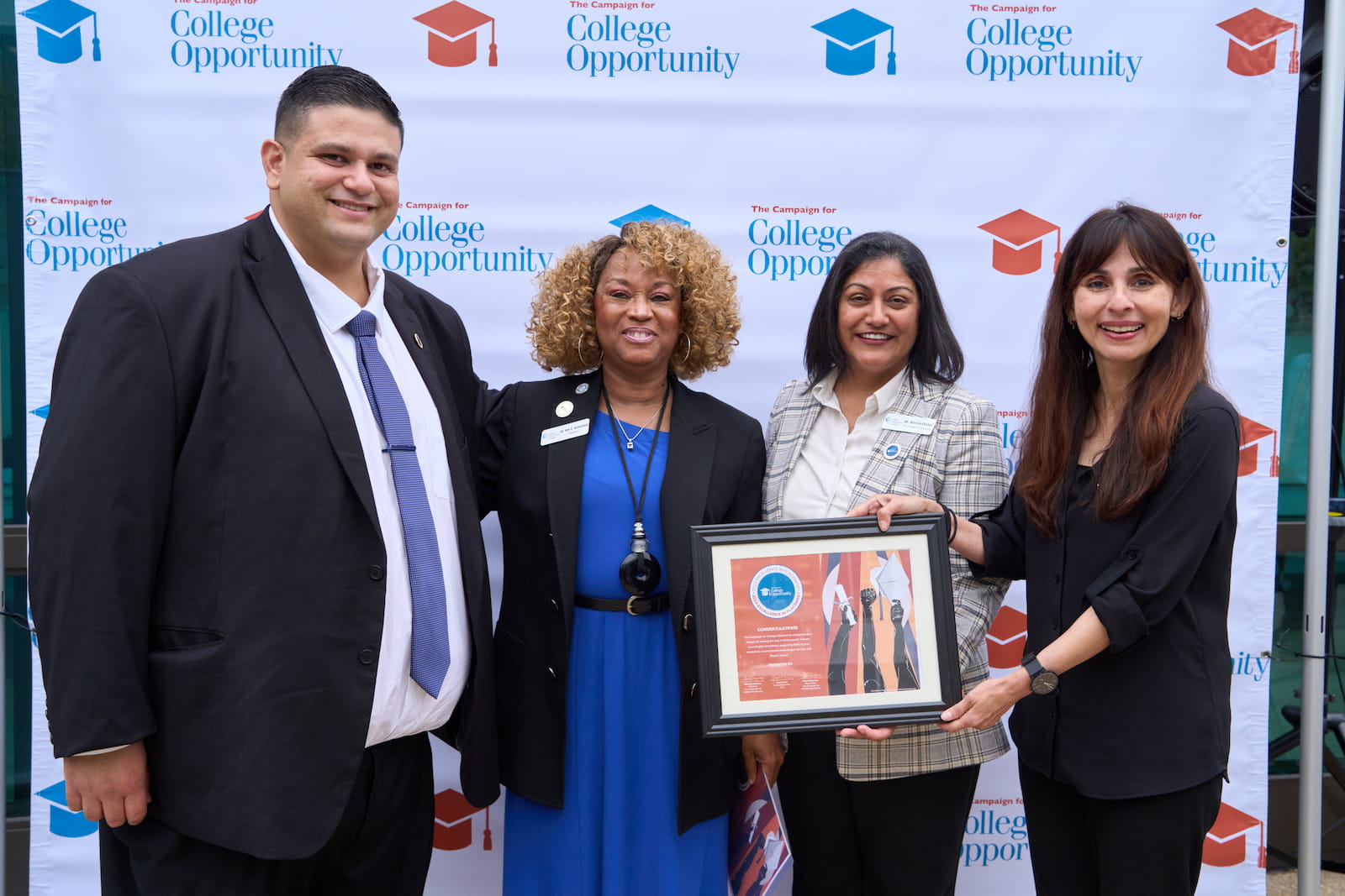 Dr. Kim Armstrong accepts an award for The Campaign for College Opportunity