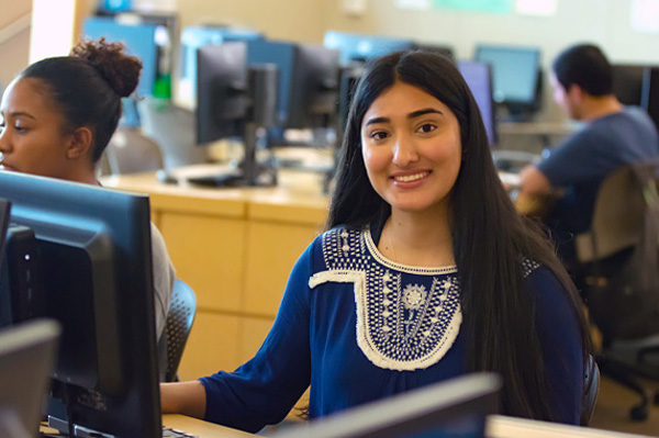 Young female student applying from her laptop