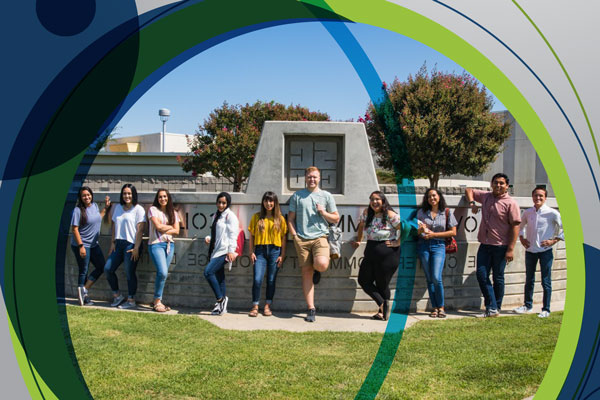 A group of students outside the main entrance of the Clovis Campus