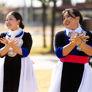 Two Asian American students dancing at the Asian American Heritage Festival