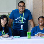 3 people sitting at the table welcoming back students