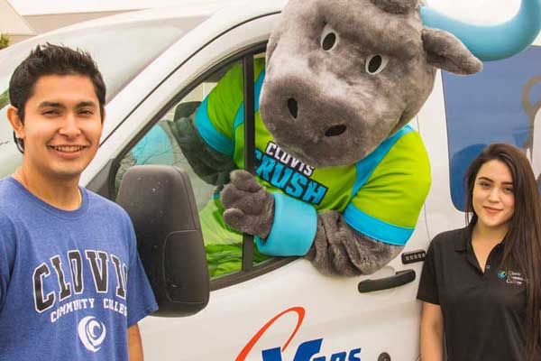 students and the Crush mascot with the shuttle bus