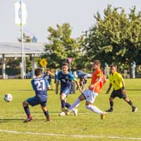CCC men's soccer team playing soccer
