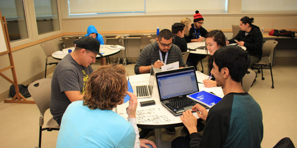 Students in the tutorial center sitting around table