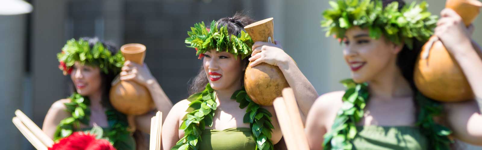 Members of the Polynesian Club of Fresno perform tradition island dances during the luau celebration at Clovis Community College on April 24