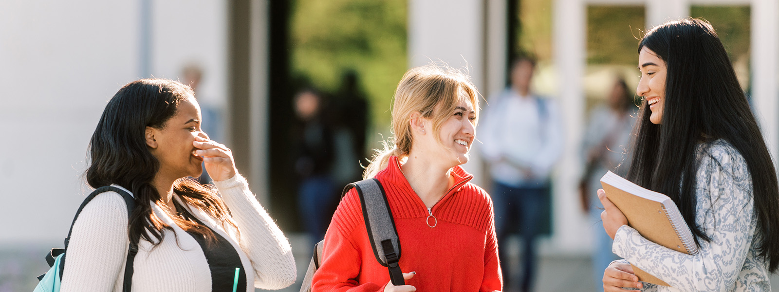 photo of group of students talking and laughing