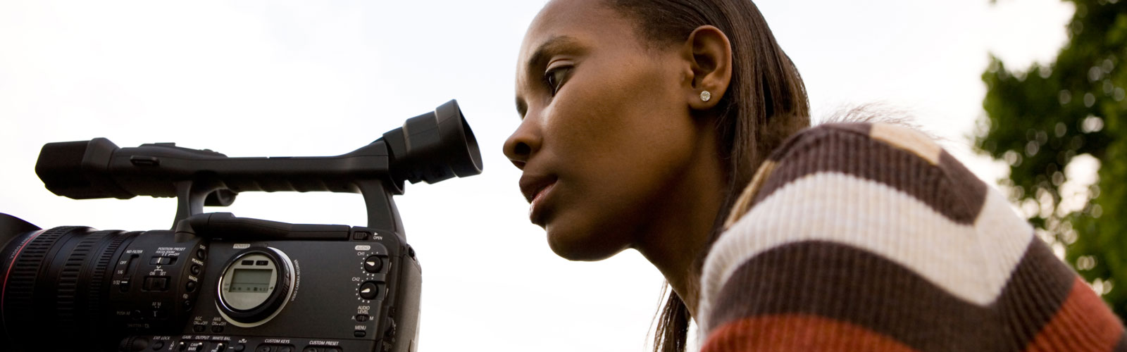 Black female filmmaker at her camera