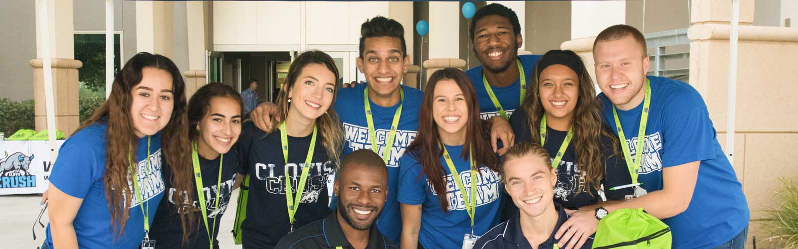 Group of students taking a group photo at college event