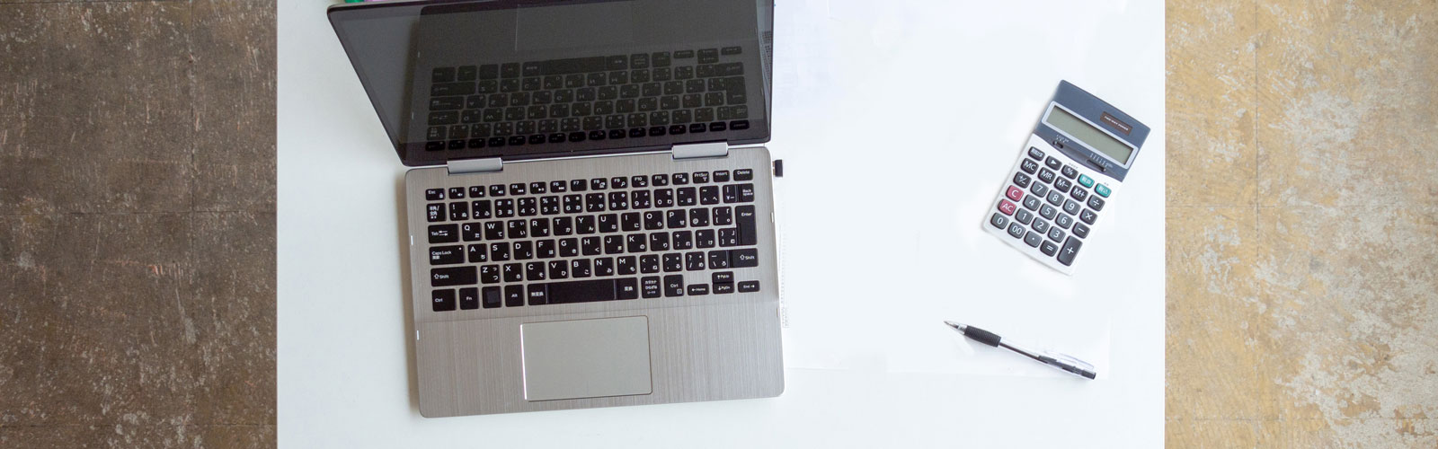 Office Desk, laptop, and calculator