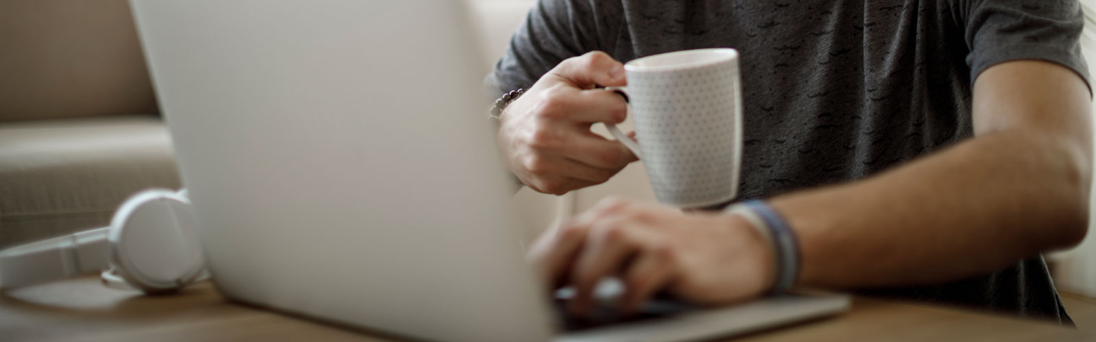 Young man using laptop at home