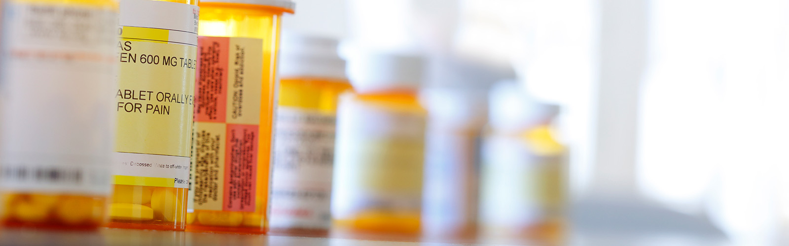 A row of pill bottles