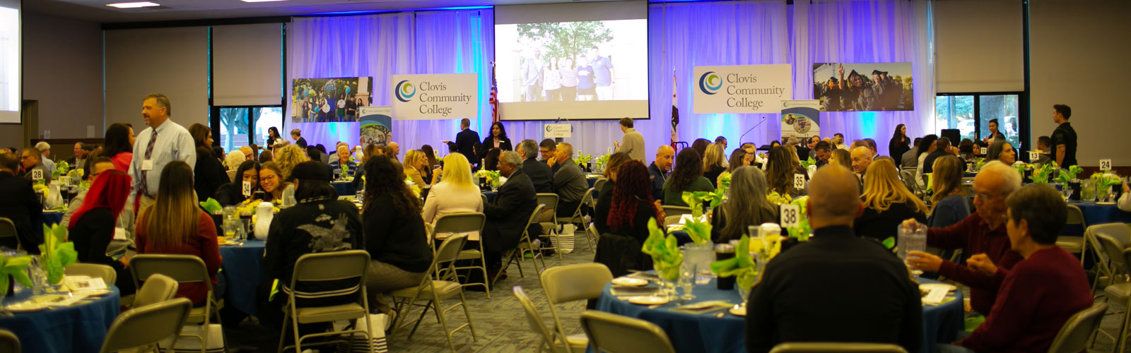 presidents breakfast event with room full of people sitting at tables