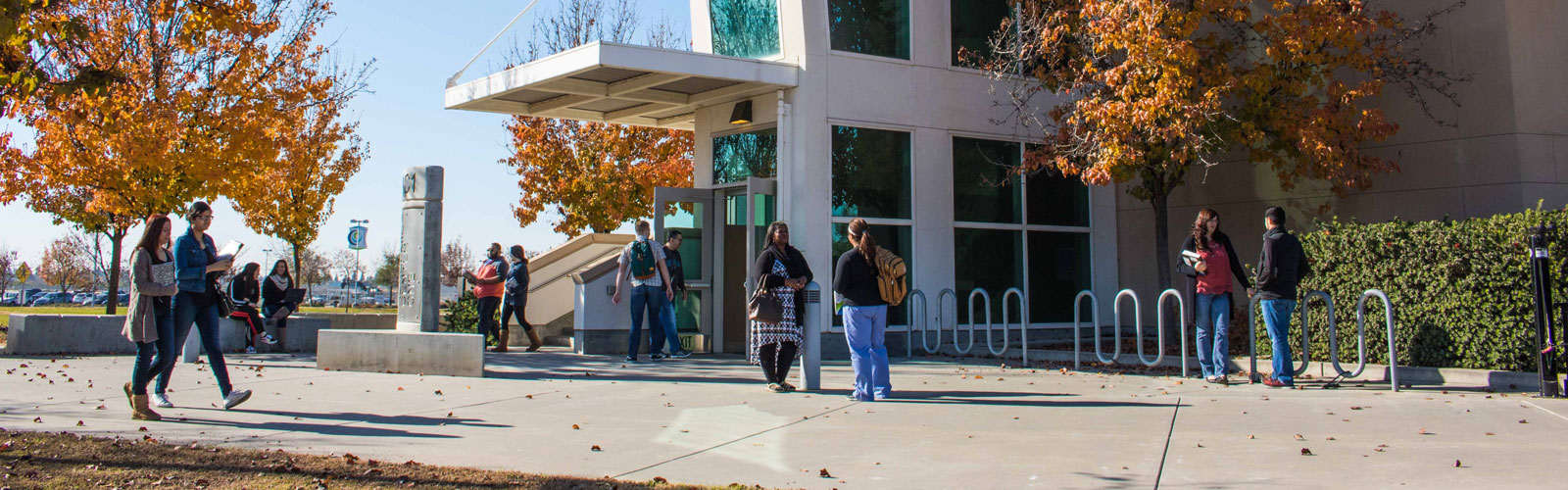 Clovis Campus academic A building with students walking in front