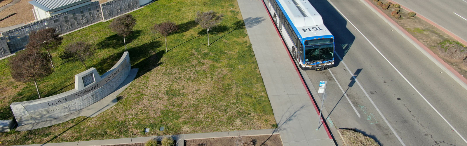 Clovis Crush Mascot and CCC students by the shuttle express bus