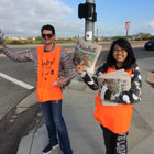 ASG students with cheerful smiles selling the annual Kids Day Fresno Bee newspaper
