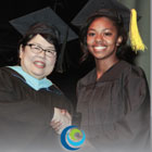 Dr Debbie and CCC student with cap