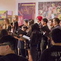 Choir students singing together in music class