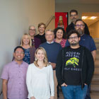 Back row (L-R): Cynthia Elliott, Teresa Ishigaki, Ann Brandon, Galin Dent, Erik Fritz. Middle row (L-R): Melanie Sanwo, Jeff Burdick, Cody Hoover. Front row (L-R): Von Torres, Jennifer Simonson