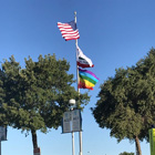 Flag poll at Clovis Community College with Pride Flag