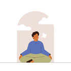 person sitting and meditating and breathing