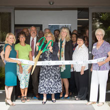 Dr. Bennet cutting the ribbon and the SBDC Ribbon Cutting event