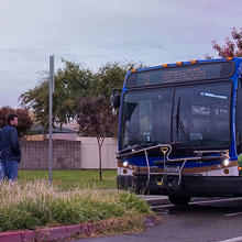 Fax bus picking up student at CCC campus