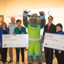 Clovis Crush with donation checks