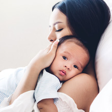 mother holding a baby