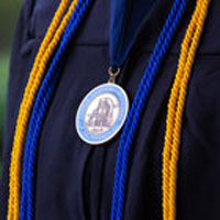 graduation regalia and medal