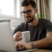 Young man using laptop at home