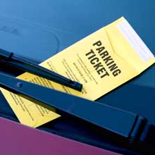 Parking ticket on car windshield