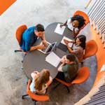 Business students sitting around a table