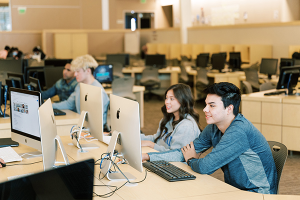 Students using a computer at school