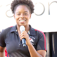 A Fresno State student holding a microphone