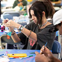 Students decorating a butterfly