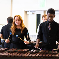 Students playing marimba