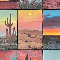 Cigarette boxes with desert landscapes painted on them