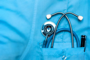 Blue nurses scrubs with a stethoscope in the pocket