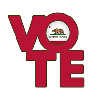 Pins on a table saying "Vote"