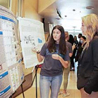 A student presenting at the STEM Symposium