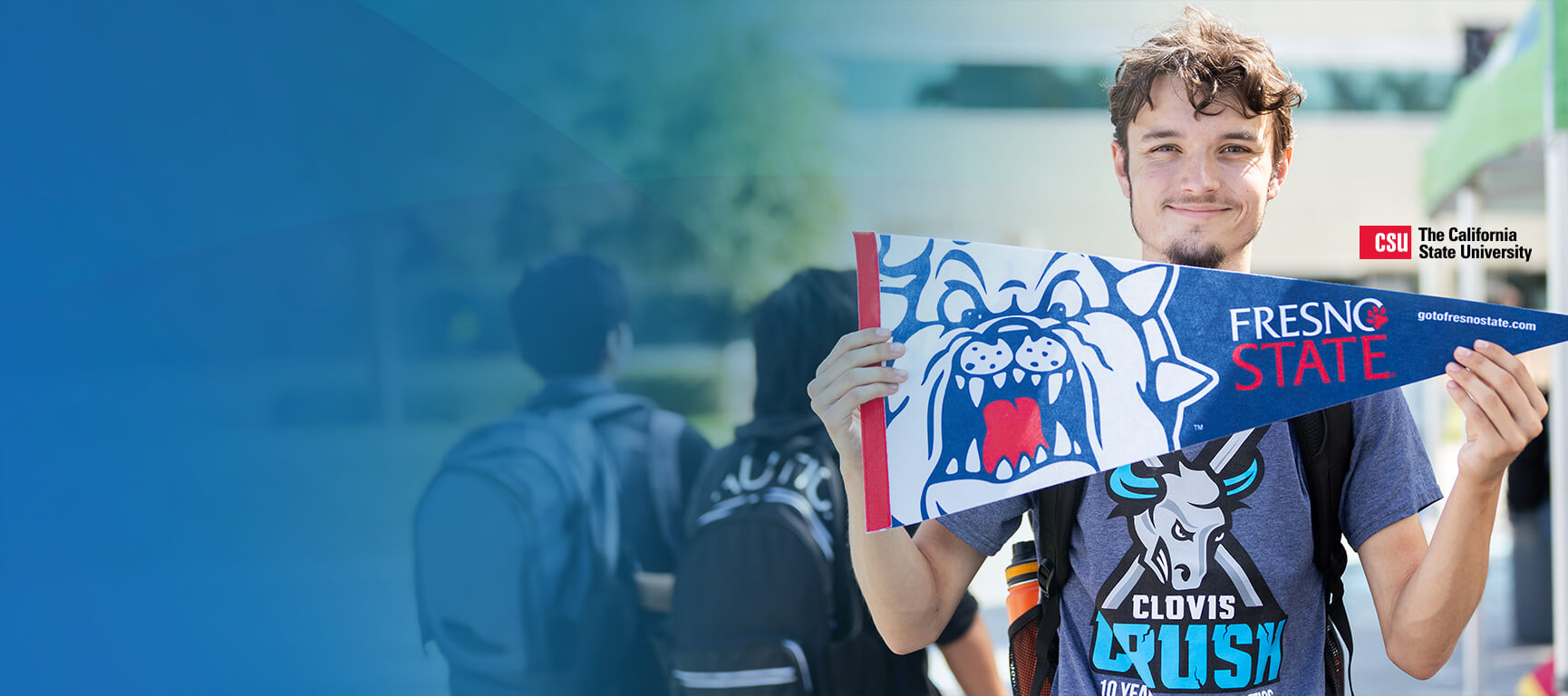 CCC student holding a Fresno State pennant