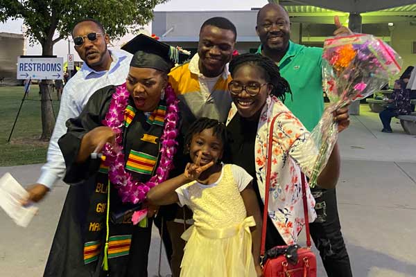 A CCC student and her family celebrating at the 2022 commencement ceremony