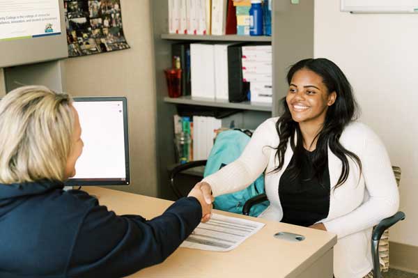 A Clovis student with one of the counselors