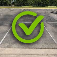 a students parking spot with a large green checkbox indicating that it's ok to park there