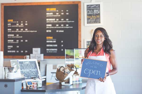 Business owner with sign