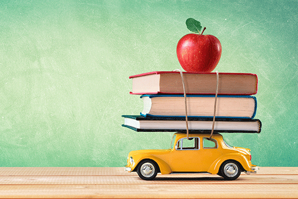 Car with books and an apple on top