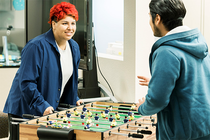 Students playing foosball