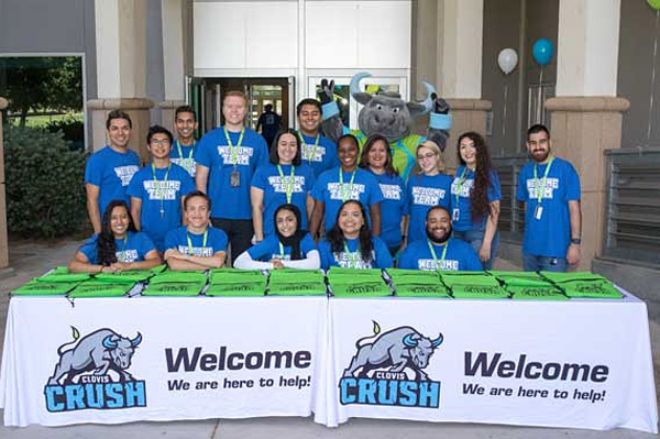 students and staff from the welcome center at a welcome event